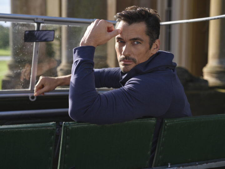 black and white image of man in a boat