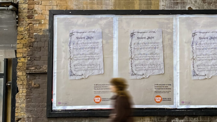 Poster on wall displaying a hymn sheet