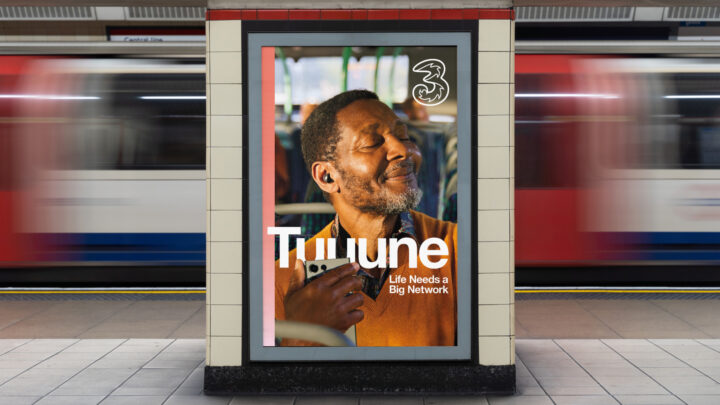 Male listens to music on phone white test in front reads Tuuuunnneeee