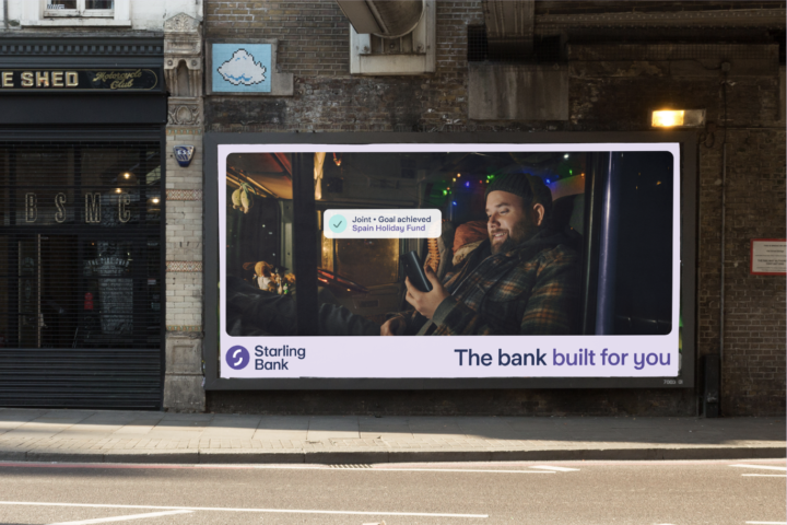 Man in lorry on phone on billboard