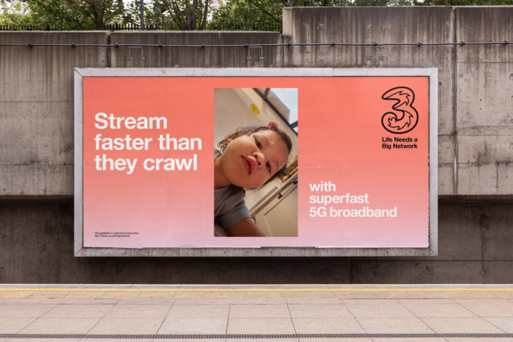 Poster on wall under bridge